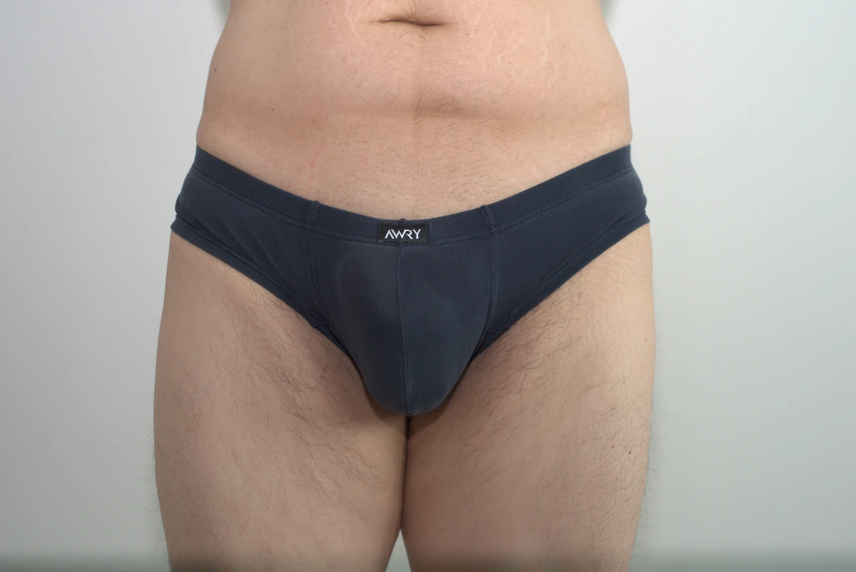 Navy AWRY CHEEKY Thong V2 in Medium: Front view showing the pouch, waist placement and wider side fabric.