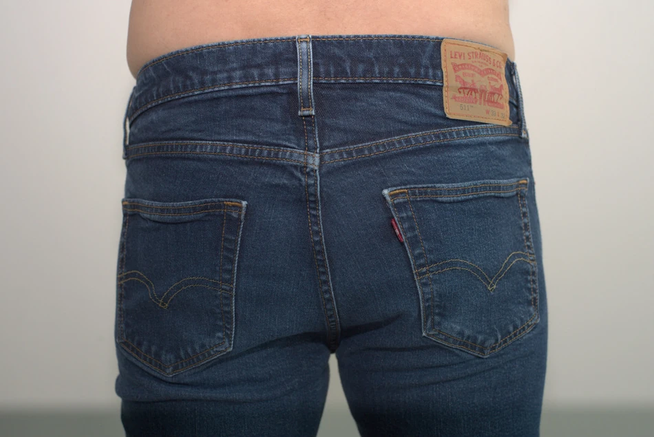 Navy AWRY CHEEKY Thong V2 in Medium: Rear under the same jeans, with the complete supplied frame retained.