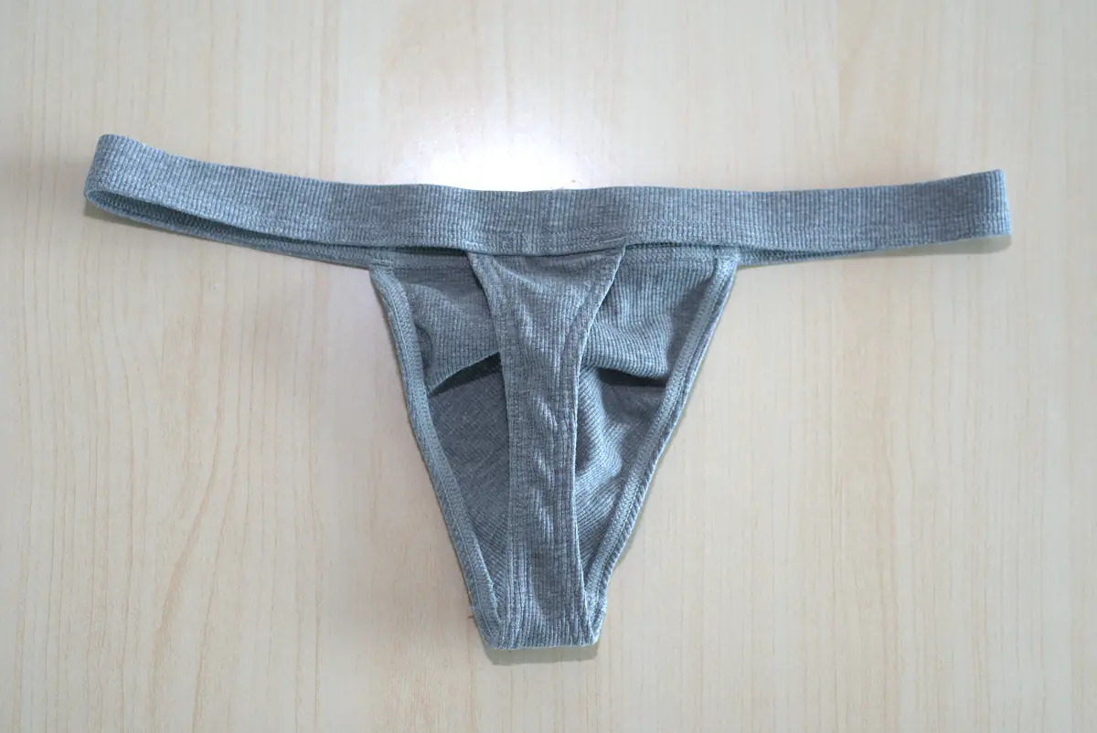 Rear flat lay of the heather gray AWRY RIBBED Thong, showing the tail and waistband construction.