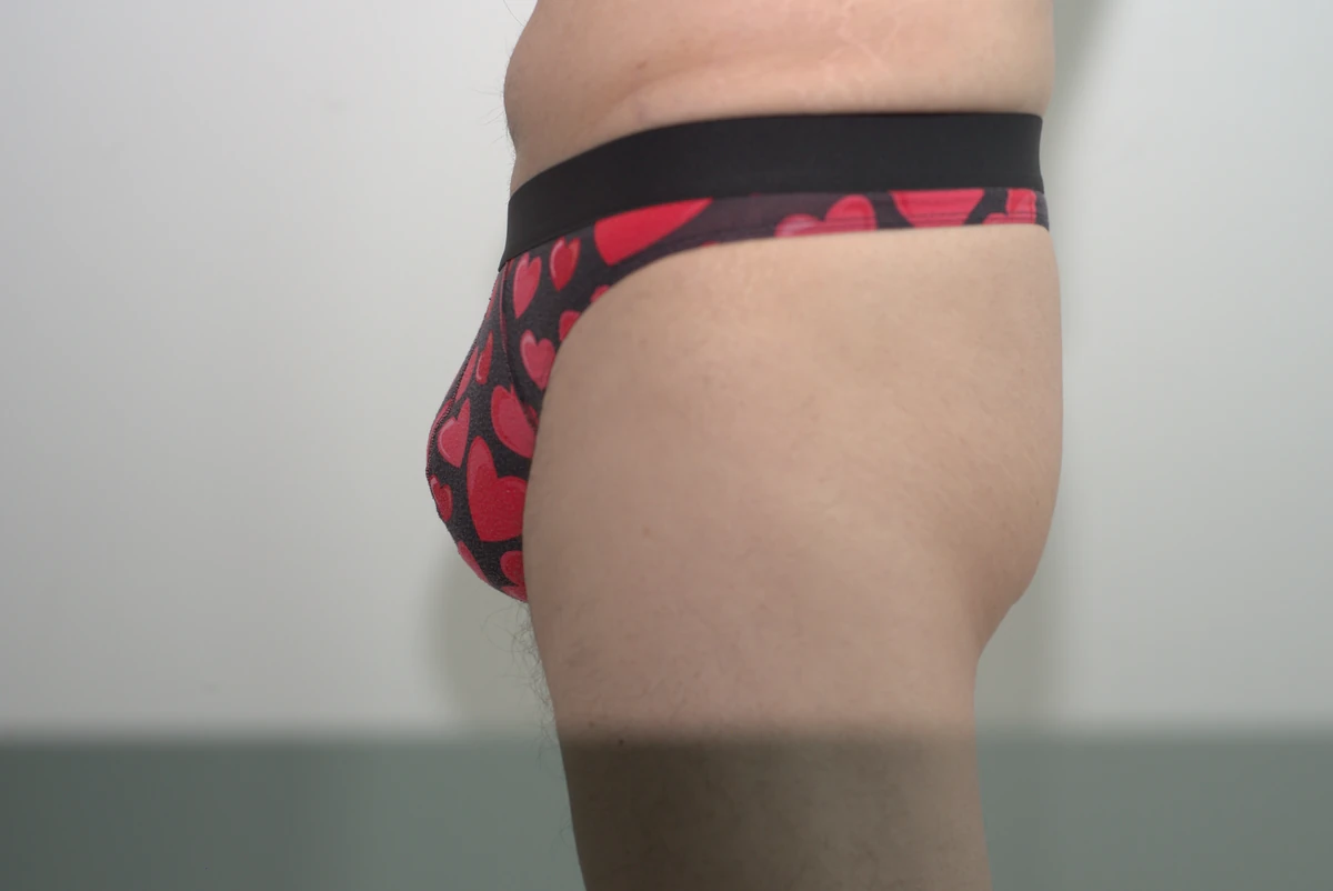 Side view of the MeUndies Pouch Front Thong in Large, showing the pouch profile, side fabric and waistband with the full garment in frame.
