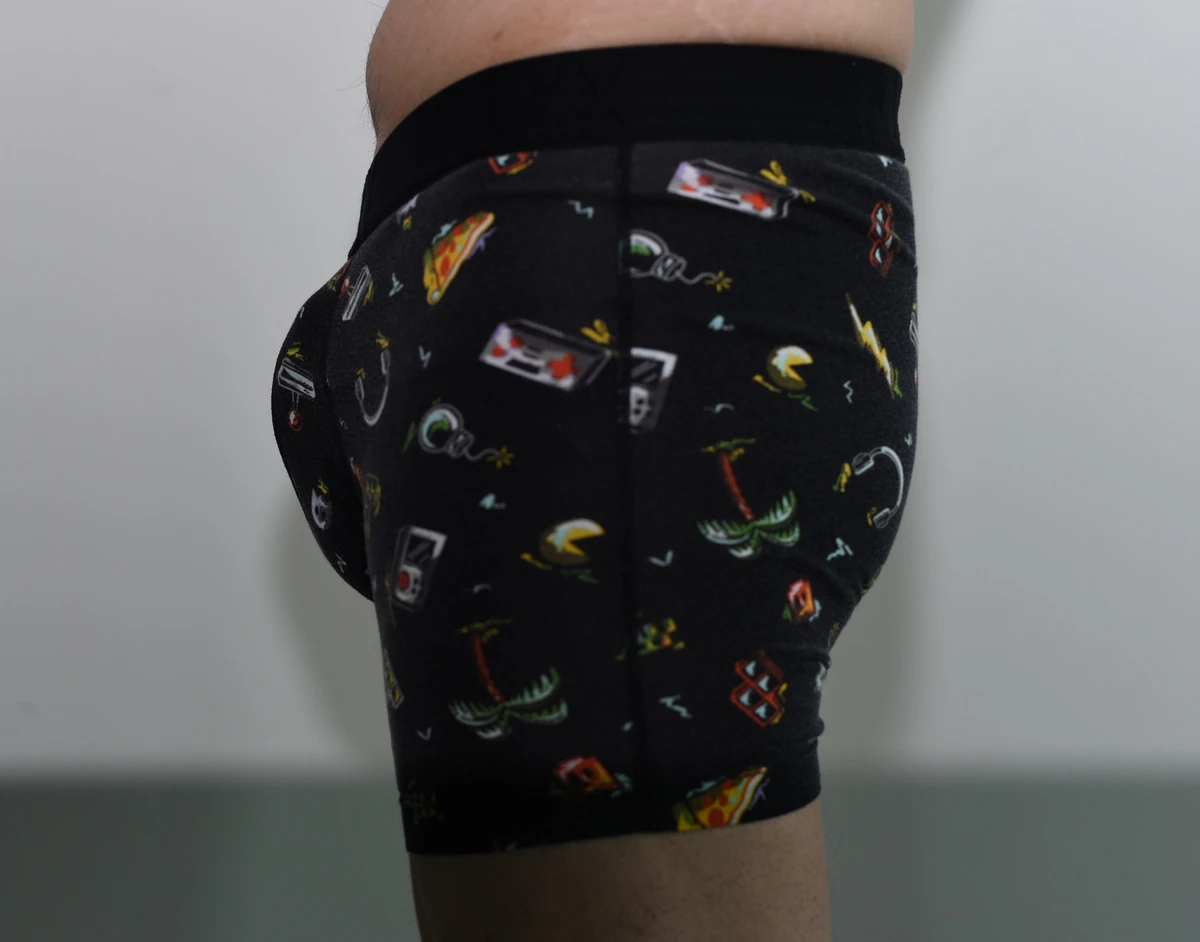 Side view of the SAXX DropTemp Cooling Cotton Boxer Brief in Medium, including the waistband and full leg hem.
